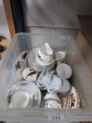 A box of assorted tea ware.