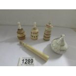 3 19th century ivory scent bottles, an ivory needlecase and one other item.