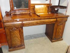 A Victorian mahogany double pedestal sideboard.