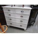 A 2 over 3 painted chest of drawers.