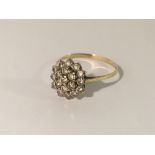 A yellow gold floral dress ring, size X.
