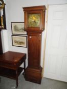 An oak long case clock with brass dial marked William Harris, Chippenham.