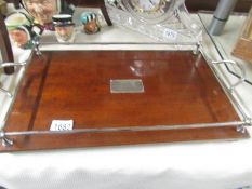 A wood and metal 1930's presentation tray.
