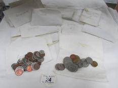 A tray of assorted coins all in envelopes.