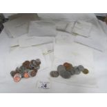 A tray of assorted coins all in envelopes.
