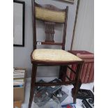 An Edwardian mahogany inlaid chair.
