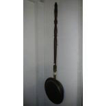 A Victorian warming pan,.