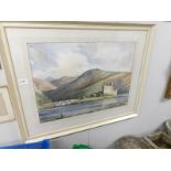 An framed and glazed watercolour entitled Eilean Donan and signed Fred Stott, 1972,