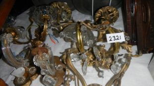 A quantity of Victorian brass and glass wall lights,
