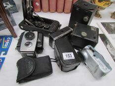 8 vintage camera's.