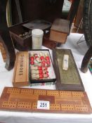 A mixed lot including chess pieces, dominoes, crib boards etc.