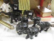 7 ebony elephants.