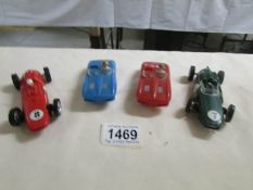 4 Scalextric type slot cars by Airfix and Marx.