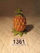 A cold painted metal inkwell in the form of a pineapple.