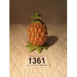 A cold painted metal inkwell in the form of a pineapple.