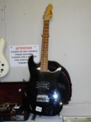 An Encore electric guitar with soft case (missing tremelo arm).
