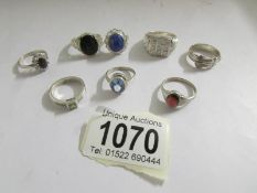 8 assorted silver rings.