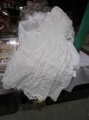 A quantity of Victorian and Edwardian night gowns (14 in total).