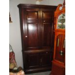 An oak corner cupboard.