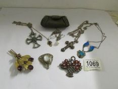 5 necklaces, 3 brooches and a vintage leather purse.