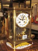 A brass cased clock.