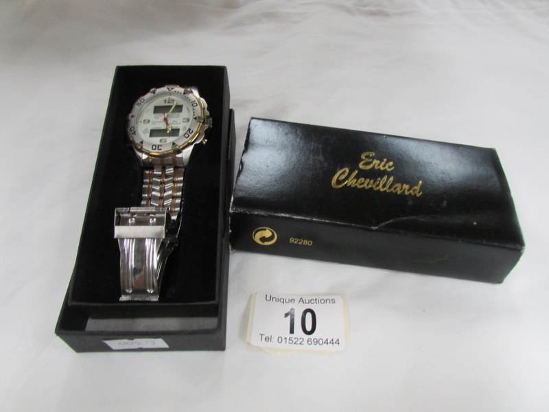 An Eric Chevalland analog wrist watch.