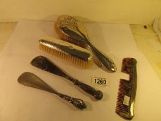 2 silver backed brushes, 2 silver handles shoe horns etc.