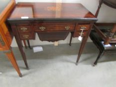A rosewood inlaid fold over games table.