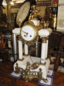 A marble and gilt mantel clock.