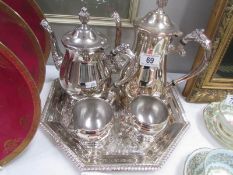 A 4 piece silver plate tea set on tray.