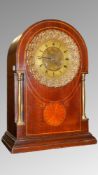 A French mahogany clock with shell inlay by Gilliot, Paris.