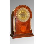 A French mahogany clock with shell inlay by Gilliot, Paris.