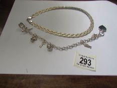 A silver necklace and charm bracelet.