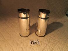 An unusual pair of WW1 silver plated trench art gun shell vases.