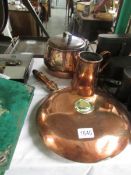 A Victorian copper warming pan, a Victorian copper saucepan with lid and a Victorian copper jug.