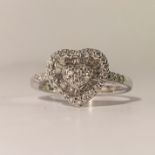 An 18ct white gold half baguette/brilliant's diamond ring, size M.