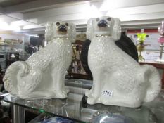 A pair of Victorian Staffordshire spaniels.