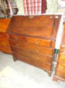 A mahogany 2 over 3 chest of drawers.