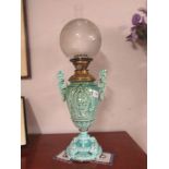 A Victorian oil lamp with turquoise base, (handles have been repaired).