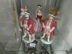 2 figures of Henry VIII and figures of his six wives.