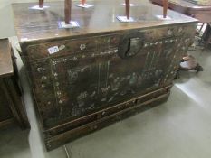 An oak trunk with Chinese decorations, (hinge requires attention).