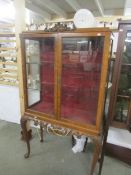 A walnut display cabinet.