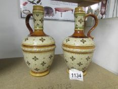 A pair of German Mettlach vases with handles,
