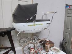 A Tri-ang dolls pram.