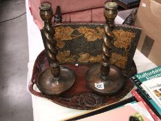 A carved wood tray, a poker work stool and a pair of barley twist candlesticks.