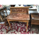 A marble top wash stand.