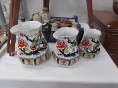 A set of 3 Losel ware Shanghai pattern graduated jugs.