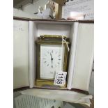 A Cope jeweller's brass carriage clock with case and documentation.