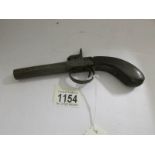 A 19th century pistol with removable barrel,.