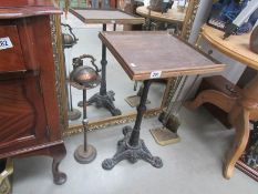 A metal based table, a companion set and a smoker's stand,.